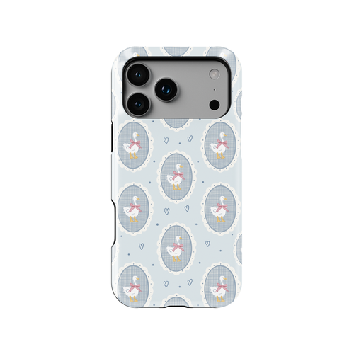 Coquette geese phone case featuring white geese with pink bows inside vintage oval cameo frames on a soft powder blue background. Lace-style scalloped edges, gingham details, tiny hearts and subtle polka dots create a feminine cottagecore aesthetic on a slim glossy cover.